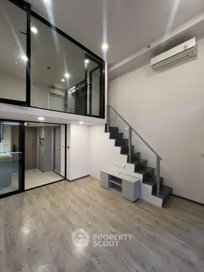 Modern loft apartment with mezzanine and sleek interior design