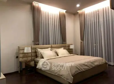 Luxurious bedroom with elegant curtains and ambient lighting