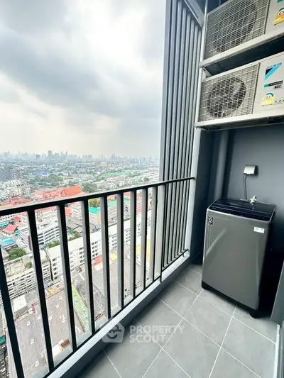 Stunning city view from high-rise balcony with modern washing machine setup.