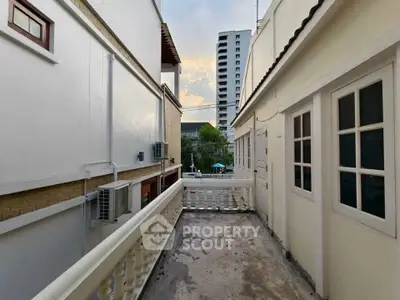 Charming urban balcony with city view, perfect for relaxing and enjoying the skyline.