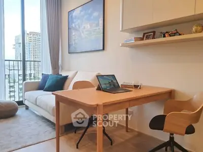 Modern living room with study area and city view, featuring sleek furniture and natural light.