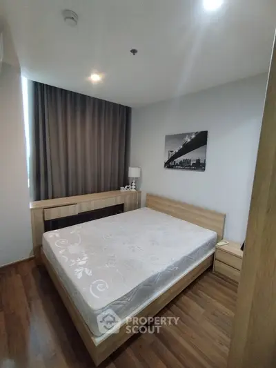 Modern bedroom with wooden flooring and stylish decor