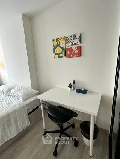 Modern bedroom with study desk and stylish decor in a cozy apartment