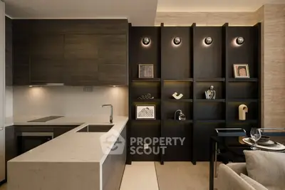 Modern kitchen with sleek cabinetry and stylish shelving in a luxury apartment.