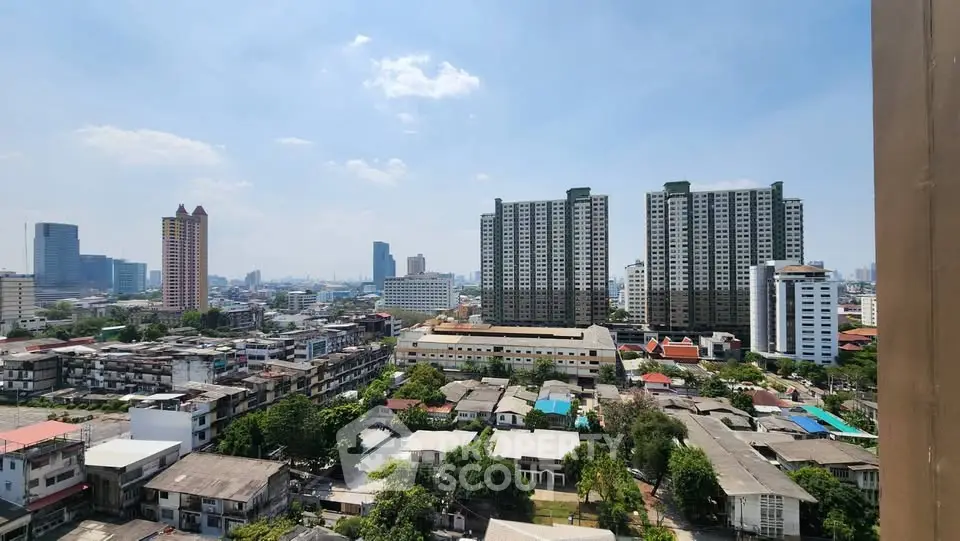 Stunning cityscape view showcasing high-rise buildings and urban landscape under a clear blue sky.