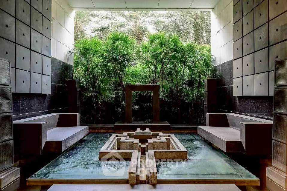 Luxurious modern garden with unique water feature and lush greenery