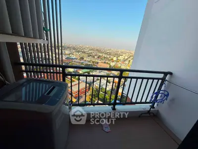 High-rise balcony with panoramic city view and washing machine setup.