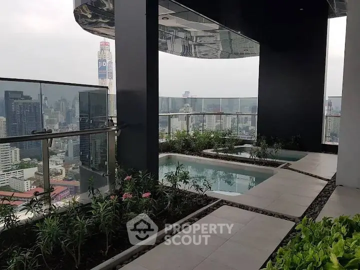 Stunning rooftop garden with pool and panoramic city views.