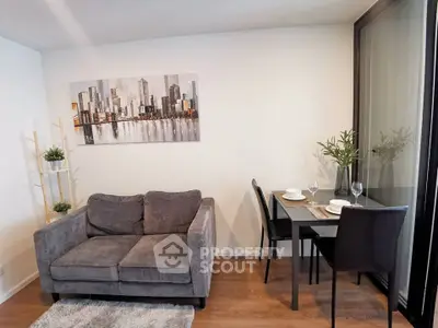 Modern living room with cozy sofa and dining area in stylish apartment.