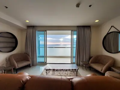 Luxurious living room with stunning ocean view and elegant furniture.