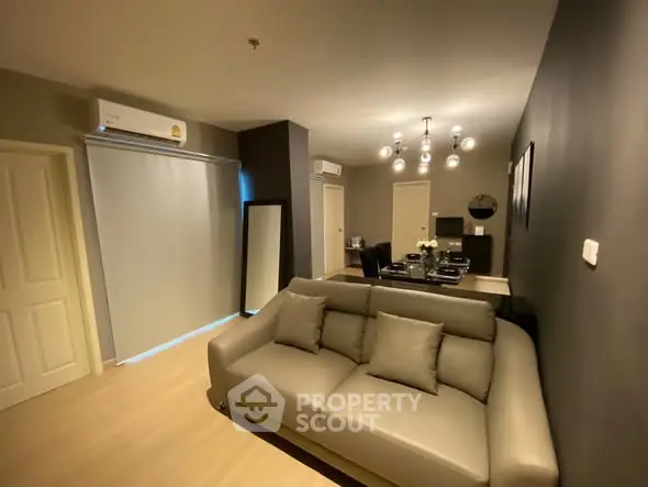 Modern living room with stylish decor and comfortable seating in a contemporary apartment.