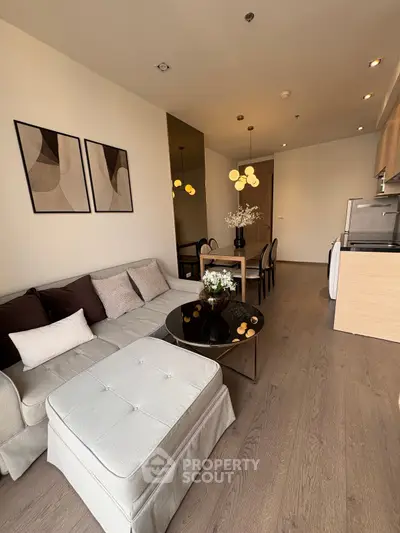 Modern living room with elegant decor and open kitchen layout