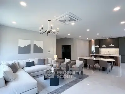 Spacious modern living room with elegant decor and open kitchen layout