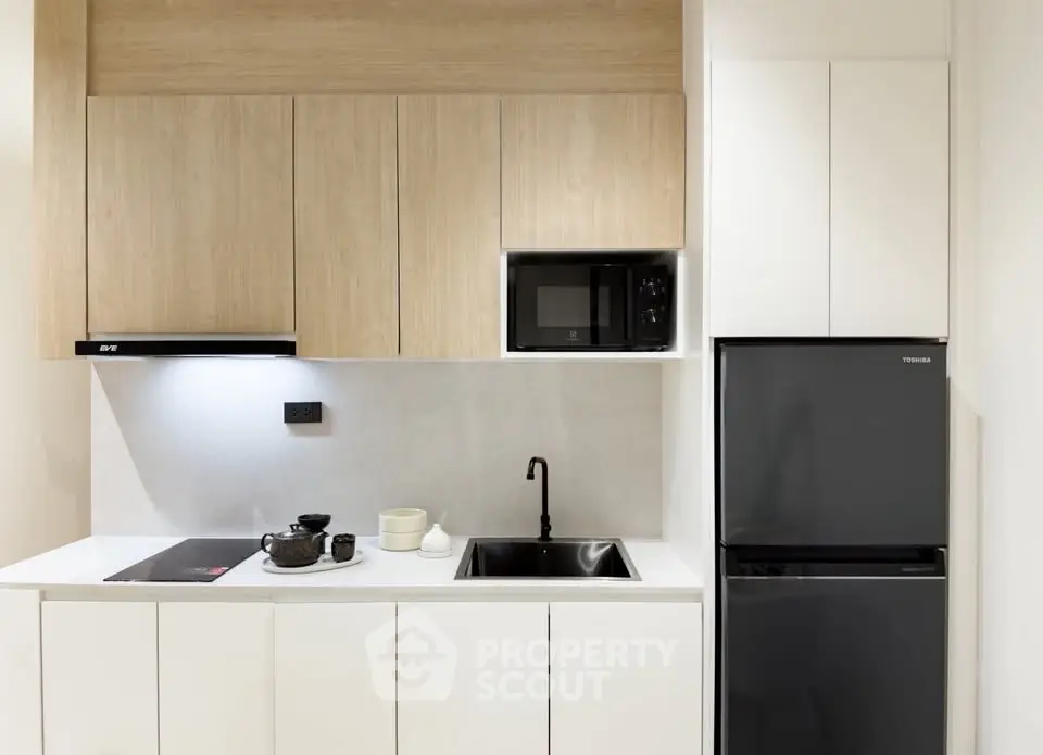 Modern minimalist kitchen with sleek cabinetry and appliances