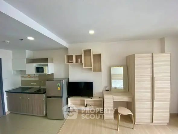 Modern studio apartment with open kitchen and stylish furniture