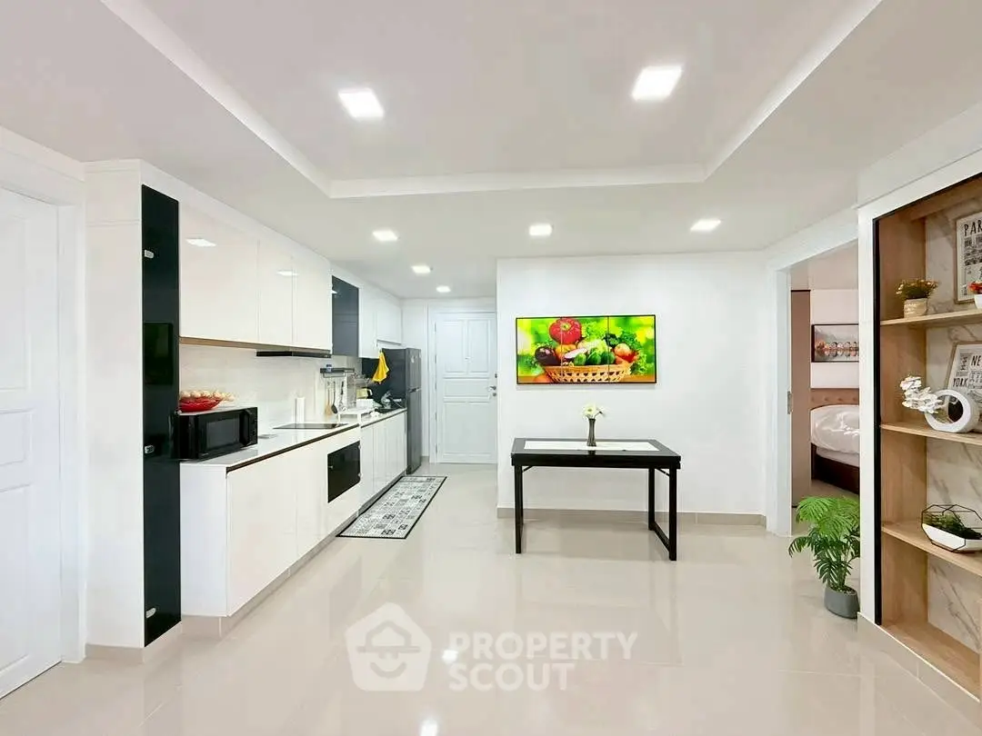 Modern kitchen with sleek design and open layout, featuring built-in appliances and stylish decor.