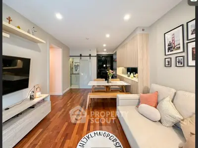 Modern living room with wooden flooring and stylish decor