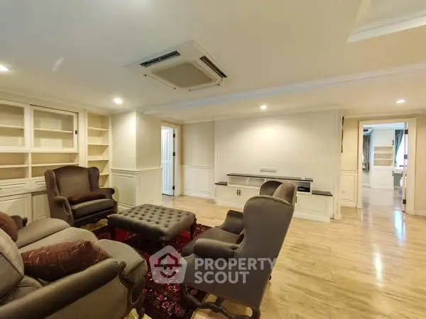 Spacious living room with elegant furniture and built-in shelves