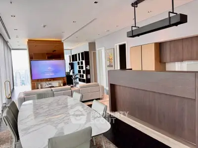 Luxurious modern living room with open kitchen and stunning city view