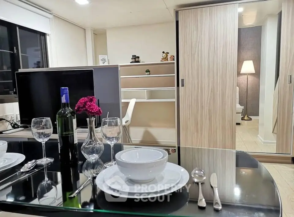Modern living room with dining area, featuring sleek furniture and elegant decor, perfect for urban living.