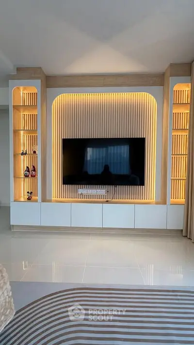 Modern living room with stylish TV wall unit and ambient lighting