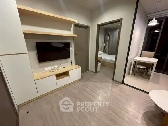 Modern apartment interior with sleek living room and bedroom view