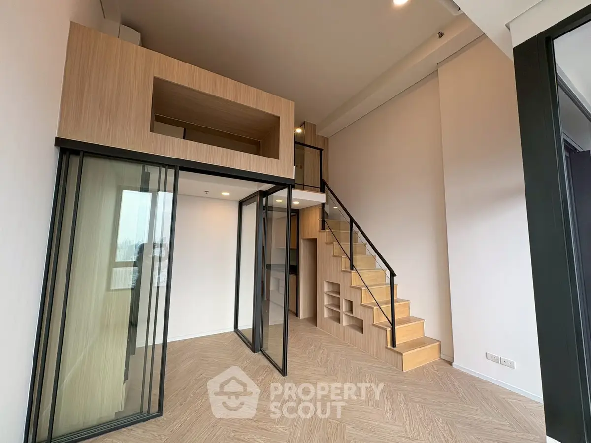 Modern loft apartment with mezzanine and glass partitions