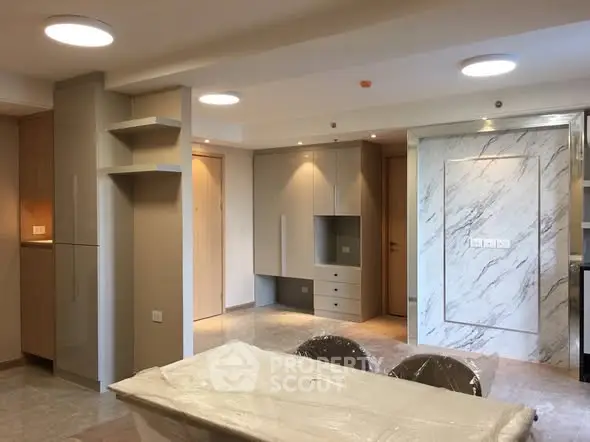 Modern interior with open layout and stylish marble accents in a new apartment.