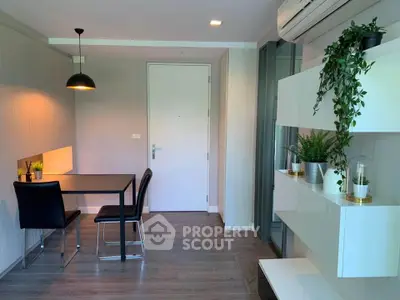 Modern interior with sleek dining area and stylish decor, perfect for urban living.