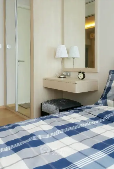 Cozy bedroom with plaid bedding and elegant decor