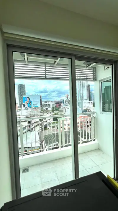 Spacious balcony with stunning city view in modern apartment