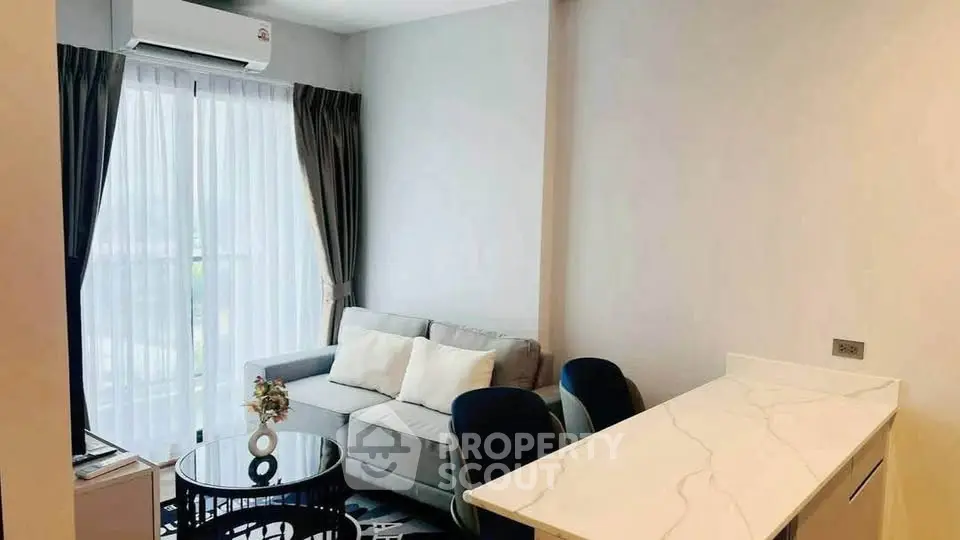 Modern living room with sleek furniture and natural light, perfect for urban living.
