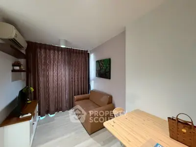 Cozy living room with brown sofa, wooden table, and elegant curtains in modern apartment.