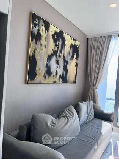 Luxurious living room with abstract art and ocean view