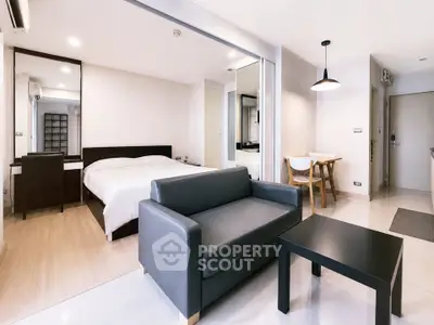 Modern studio apartment with sleek furniture and open layout