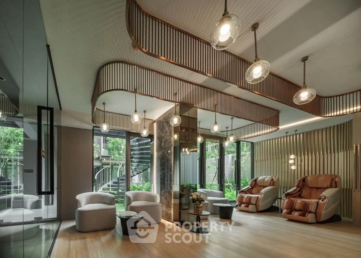 Luxurious modern living room with elegant lighting and plush seating, featuring large windows with garden views.