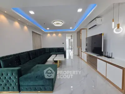 Luxurious modern living room with elegant green sofa and sleek TV setup