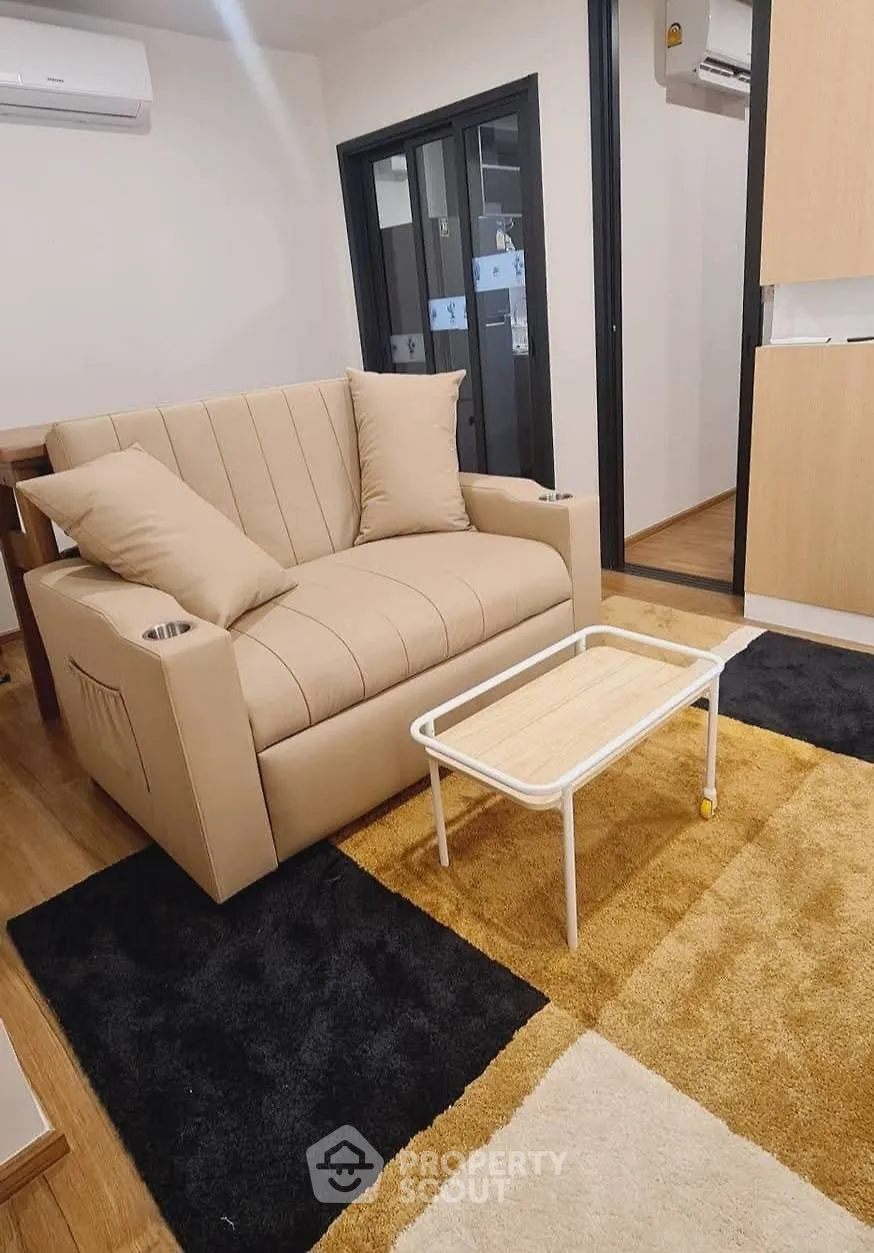 Cozy living room with modern beige sofa and stylish coffee table