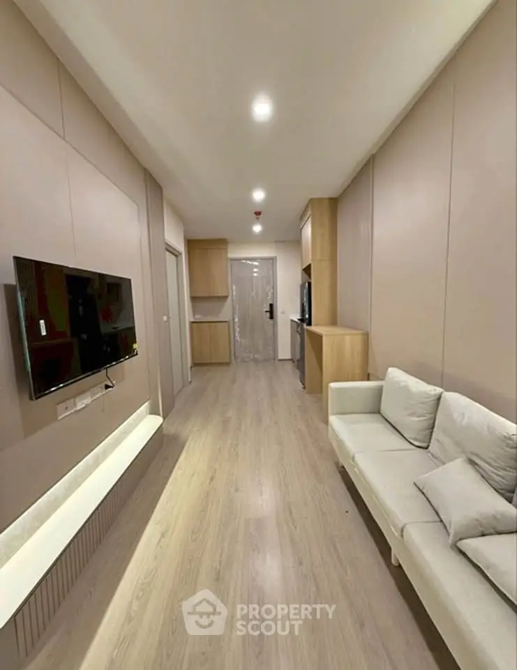 Modern living room with sleek design and cozy sofa in a stylish apartment.