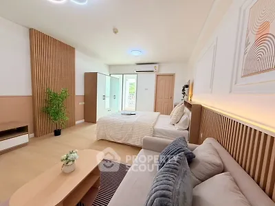 Spacious modern bedroom with stylish decor and natural light
