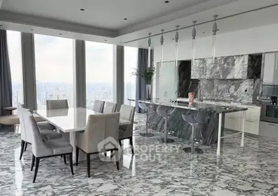 Luxurious modern kitchen with marble flooring and panoramic city views