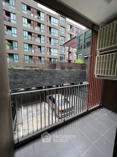 Modern apartment balcony with urban view and sleek design