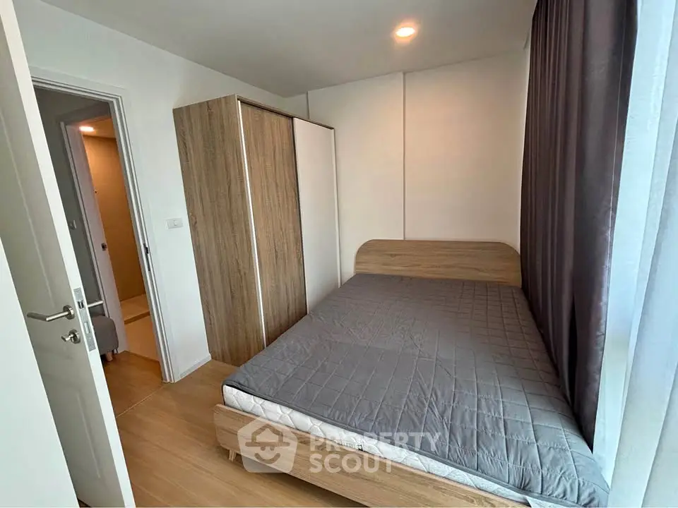 Cozy bedroom with wooden furniture and ample natural light