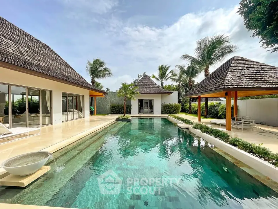 Luxurious tropical villa with private pool and lush garden, perfect for serene living.