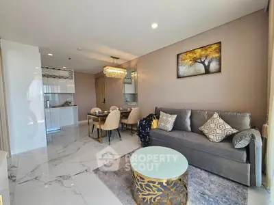 Luxurious modern living room with elegant decor and open kitchen layout