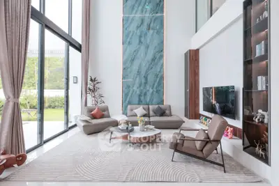 Luxurious modern living room with high ceilings and elegant decor