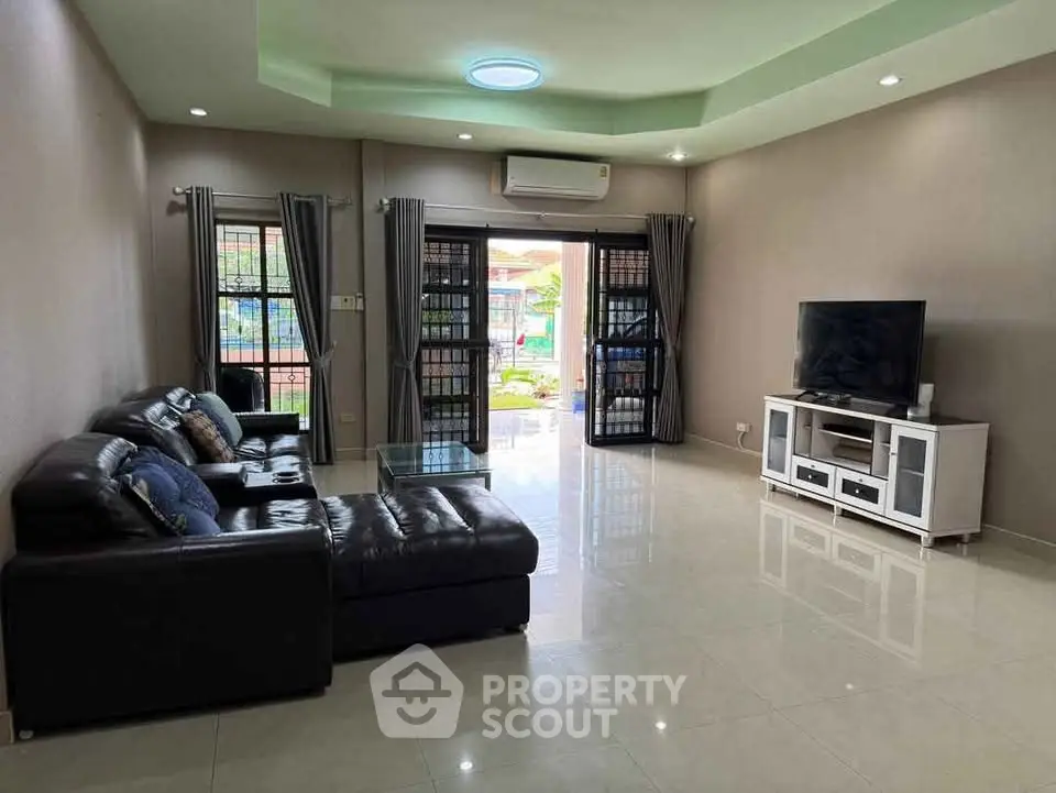 Spacious living room with modern furniture and natural light