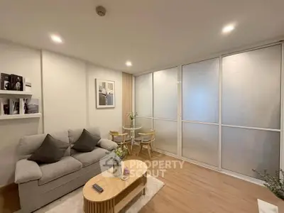 Modern living room with cozy sofa and elegant decor in a stylish apartment.