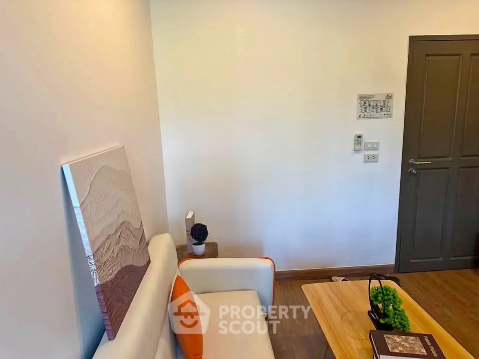 Cozy living room with modern decor and comfortable seating, perfect for relaxation.