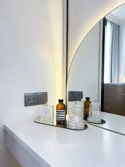Modern bathroom vanity with elegant mirror and stylish decor